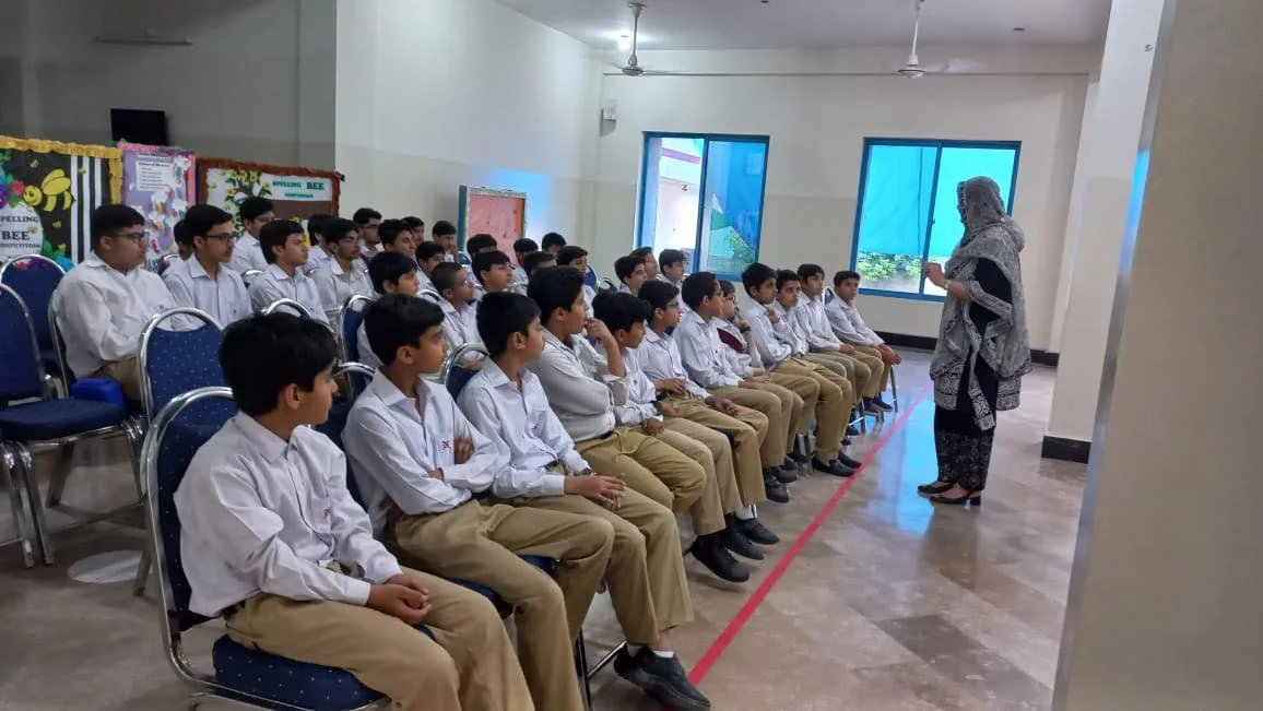A teacher leading a learning session with seated Nurture students