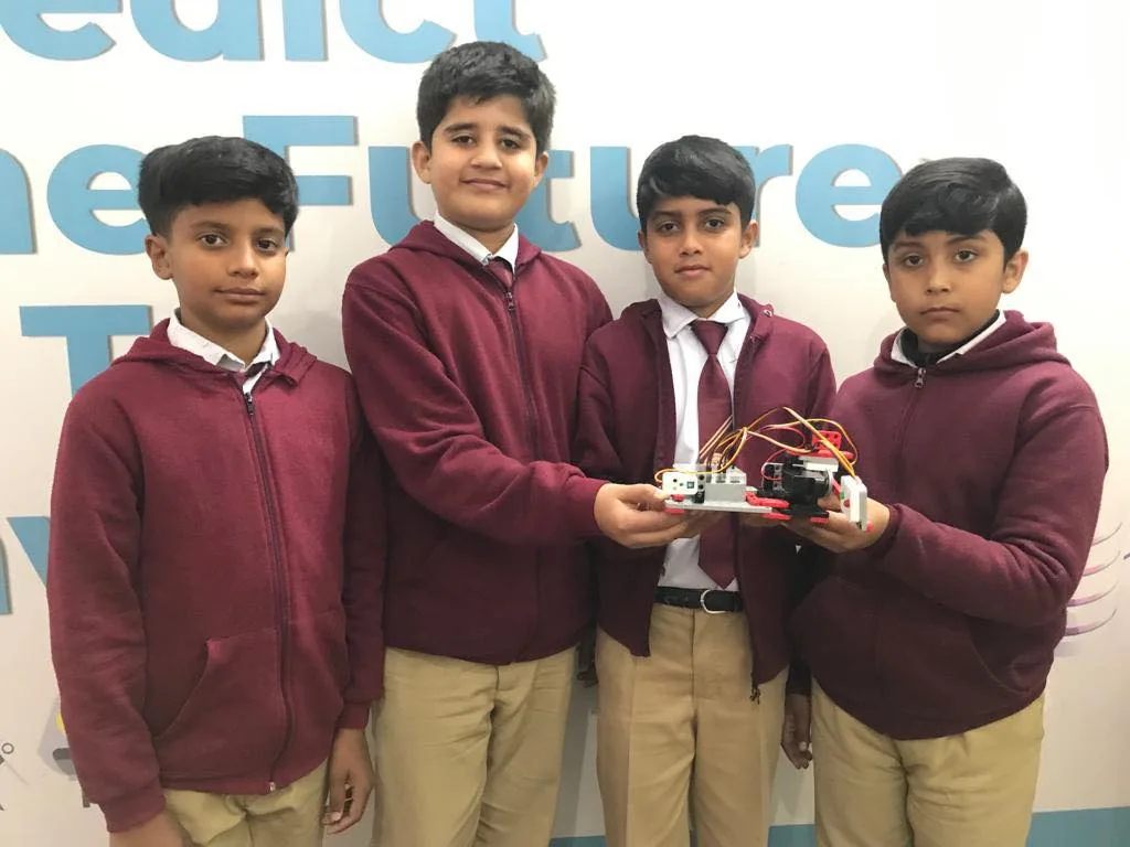 Secondary students presenting a robotics project